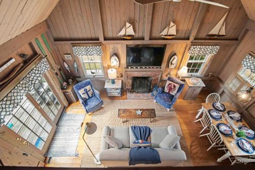 an overhead view of a living room in a house at 5 Min Walk to Swimmable Mill Pond Dog Friendly in Orleans