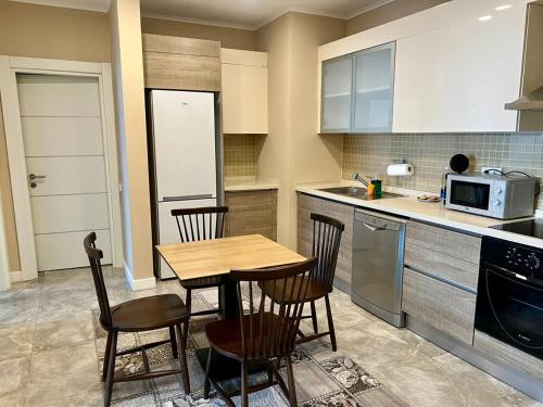 Kuchyň nebo kuchyňský kout v ubytování Bishkek Park Residence