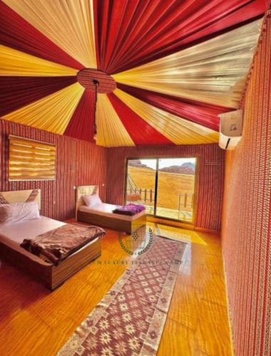 Ένα ή περισσότερα κρεβάτια σε δωμάτιο στο RUM lUXURY ELEGANCE CAMP