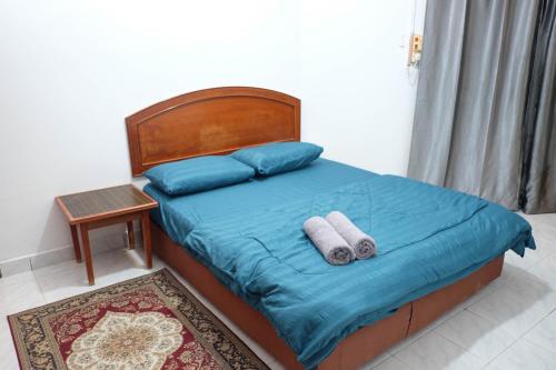 Postel nebo postele na pokoji v ubytování Inap Desa Chempaka, Golden Straits Villa
