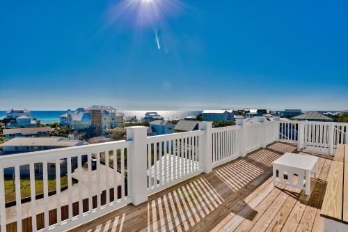 a balcony with a view of the ocean at Gilligan's Island in Inlet Beach