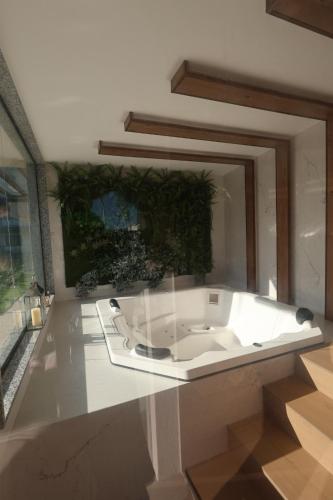 a bathroom with a white sink in a room at Estúdio completo recém inaugurado com linda vista! in Niterói