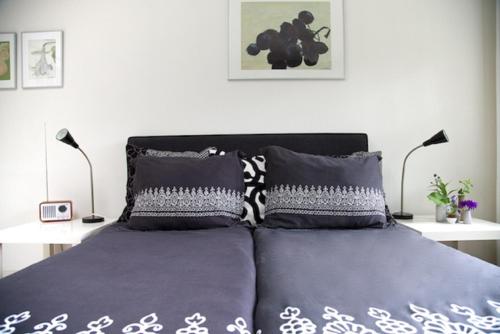 En eller flere senge i et værelse på Logement-B&B Safier