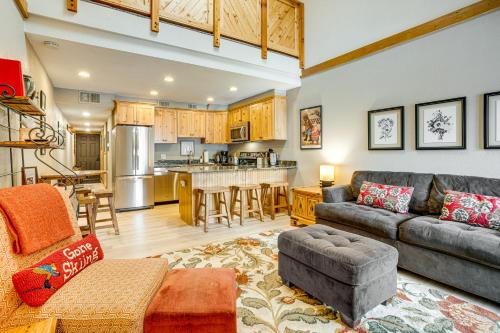 a living room with a couch and a kitchen at Ski and Relax Fireside Frisco Gem with Resort Perks! in Frisco