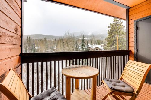 a balcony with a table and two chairs and a large window at Ski and Relax Fireside Frisco Gem with Resort Perks! in Frisco