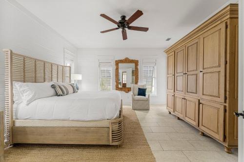 a bedroom with a bed and a ceiling fan at Hope Town Pearl Cottage in Rosemary Beach