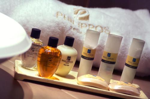 a tray with a bunch of bottles of hair products at Philippos Xenia Hotel in Serres