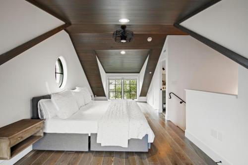 a bedroom in a house with a large bed at Oasis Cottage & Carriage House in Rosemary Beach