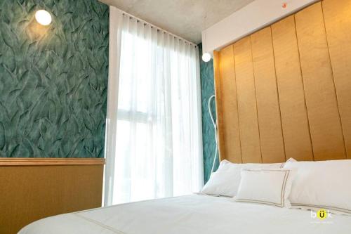 Ένα ή περισσότερα κρεβάτια σε δωμάτιο στο Golden Room Secrt Sabana AC