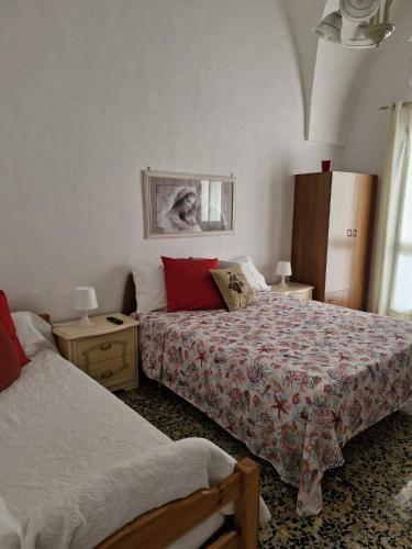 Кровать или кровати в номере Pietra su Pietra Casa Vacanze