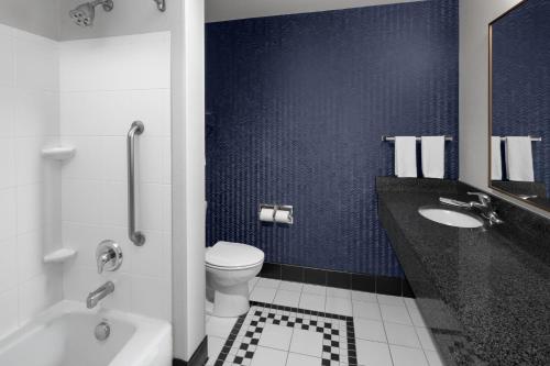 a bathroom with a toilet and a sink at Richfield Fairfield Inc in Richfield