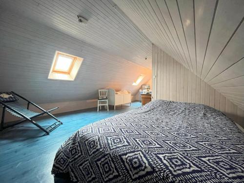 a bedroom with a large bed in a house at Maison Kersaliou, proche mer St Pol de Léon in Saint-Pol-de-Léon