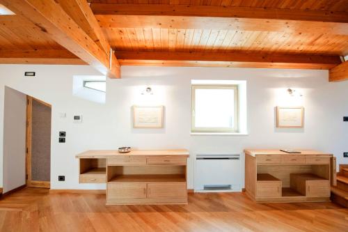 a room with wooden desks and a window at Modica-Apartments in Modica