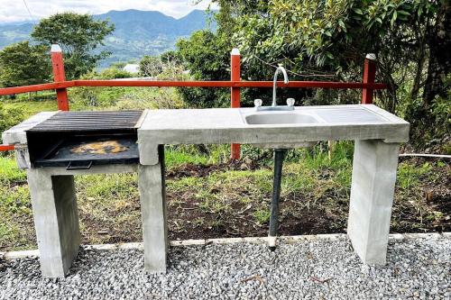 a stone sink sitting on top of a table at Cabaña La Finca in Cervantes