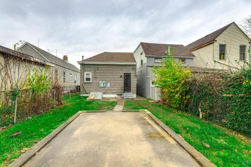 a house with a driveway in a yard at 3 Mi to Dtwn Covington Getaway with Backyard in Covington