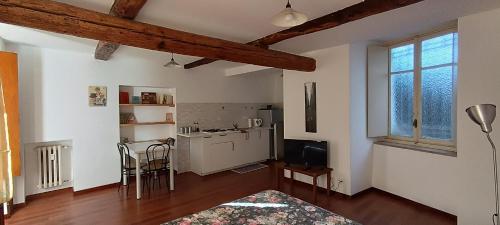 a room with a kitchen and a living room at Del Nobile Apartment II in Turin