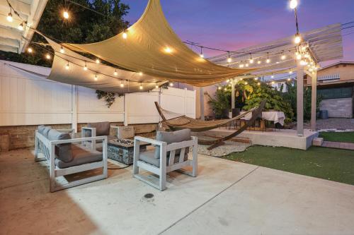 a patio with a tent and chairs and a hammock at Spacious Family Retreat in the heart of San Diego in San Diego