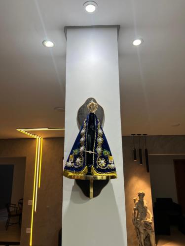a dress on display in a museum exhibit at Hotel Pousada Colliseu in Aparecida