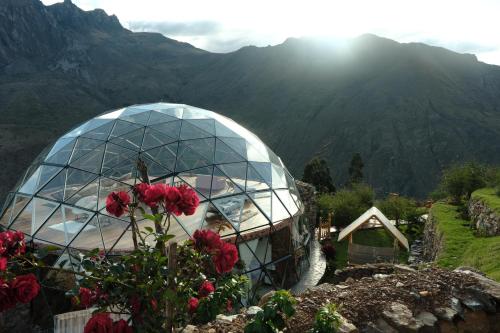 a domed building with a view of a mountain at Stardome Spiritual Experience in Ollantaytambo