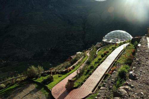 a garden on the side of a mountain at Stardome Spiritual Experience in Ollantaytambo