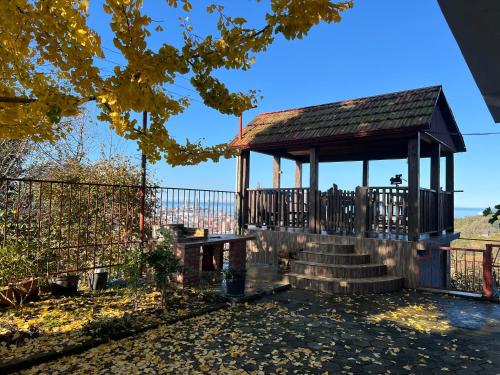 a gazebo with stairs and a fence at GT House Batumi in Batumi