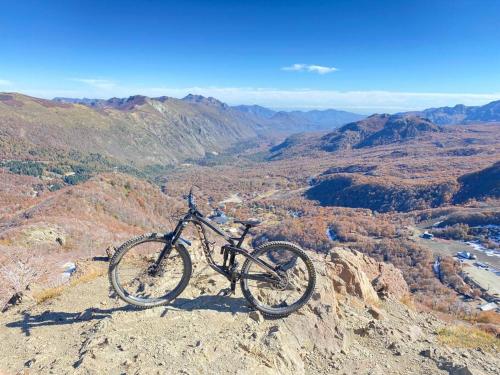 a bike parked on top of a mountain at Refugio Andes Indómito, Las Trancas in Las Trancas
