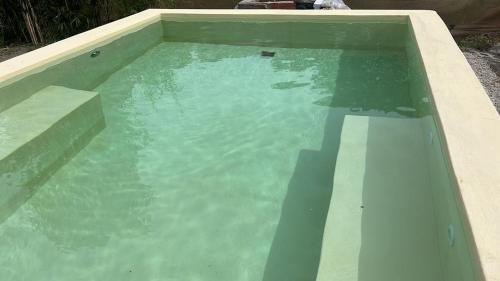 a swimming pool with blue water in a backyard at Stella Maris in Costa del Este
