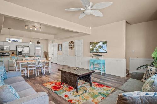 a living room with a couch and a table at Walk to Beach Shared Pool & Grill Dog Friendly in Padre Island