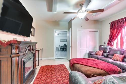 a living room with a couch and a flat screen tv at 10 Mi to Yosemite Lake Atwater Retreat in Atwater