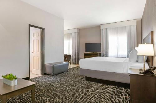 a large hotel room with a bed and a desk at Best Western Plus Sun Canyon in Sierra Vista