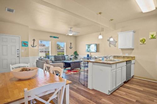 a kitchen and living room with a table and a dining room at 3 Br Padre Isl Retreat Min to Beach Dog Friendly in Padre Island