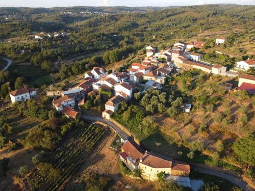 an aerial view of a village on a hill at Yellow House - Casa Amarela in Oliveira do Hospital