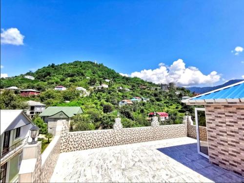 a view of a mountain from the balcony of a house at GT House Batumi in Batumi