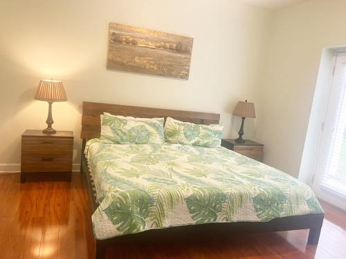 a bedroom with a bed and two nightstands and two lamps at Mountain View Condos - Unit 5105 in Pigeon Forge