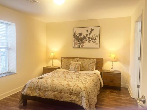 a bedroom with a bed with two night stands and two lamps at Unit 5106 - Mountain View Condos - Free Attraction Ticket including Dollywood in Pigeon Forge