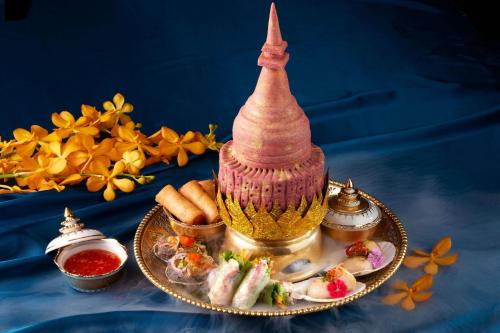 a plate of food with a tower on top of it at Sheraton Grand Taipei Hotel in Taipei
