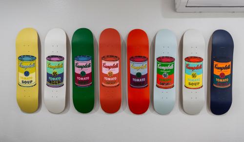 four snowboards are lined up on a wall at 50 M to Sand LGB 2 King Suites in Long Beach