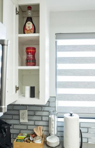 a kitchen with a counter top with a window at 50 M to Sand LGB 2 King Suites in Long Beach