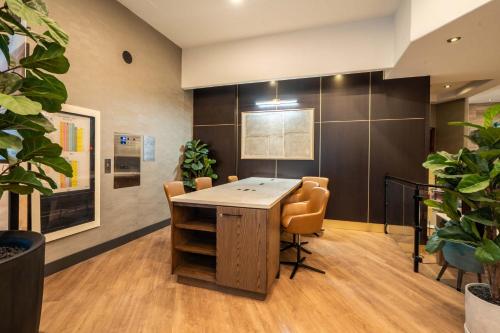 a conference room with a table and chairs at Sandman Hotel Vancouver Downtown in Vancouver