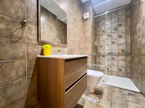 a bathroom with a sink and a toilet at Luxury Apartment by Sea in Martil