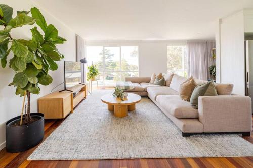 a living room with a couch and a table at Welcome to Casa Clifton! in Clifton Springs