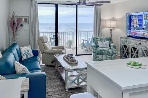 a living room with a view of the ocean at Seaside Beach & Racquet Club #4611 in Orange Beach