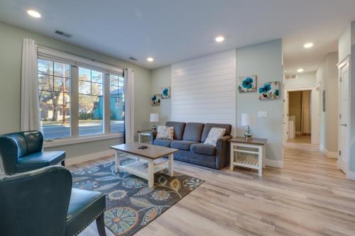 a living room with a couch and a table at Front Street Retreat! Cozy Traverse City Condo in Traverse City