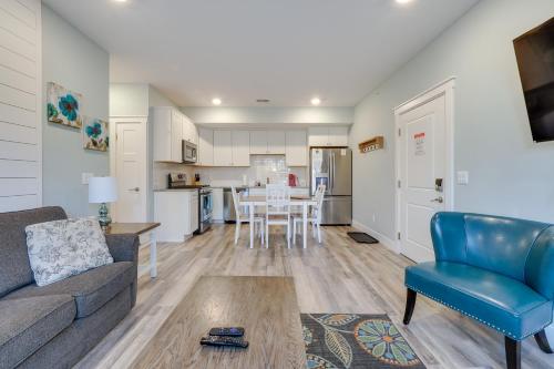 a living room with a couch and a table at Front Street Retreat! Cozy Traverse City Condo in Traverse City
