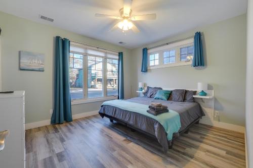 a bedroom with a bed and a ceiling fan at Walk to Beach Traverse City Condo on Front Street in Traverse City