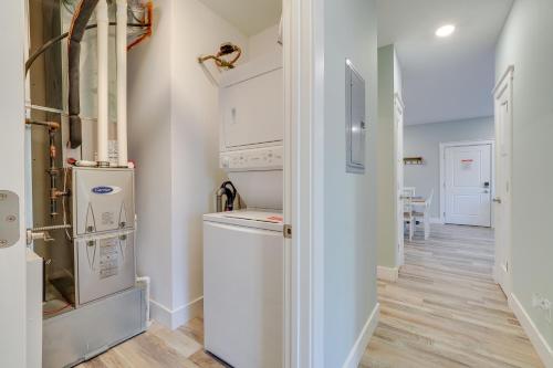 a laundry room with a washer and dryer at Walk to Beach Traverse City Condo on Front Street in Traverse City