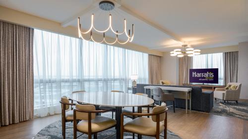 a living room with a table and chairs at Harrah's Resort Atlantic City, A Caesars Destination in Atlantic City