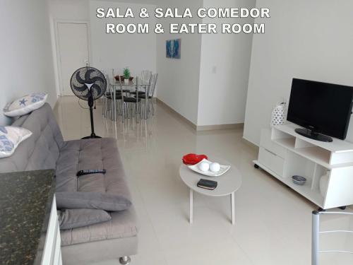 Μια τηλεόραση ή/και κέντρο ψυχαγωγίας στο Quarto em Apartamento compartilhado Praia do Morro, Guarapari, Es - 20 m da Praia