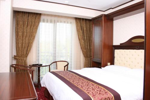 Postel nebo postele na pokoji v ubytování Hestia Hotel