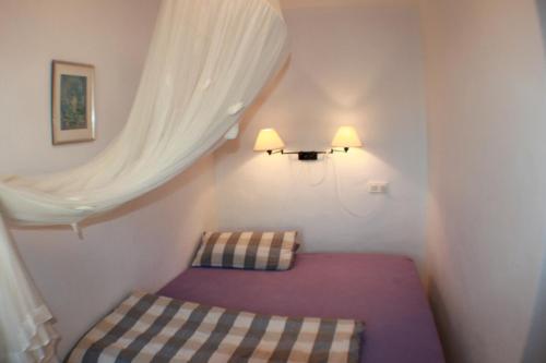 a small room with a bed and a window at Luz - holiday apartment in peaceful surroundings in Benissa in Benissa